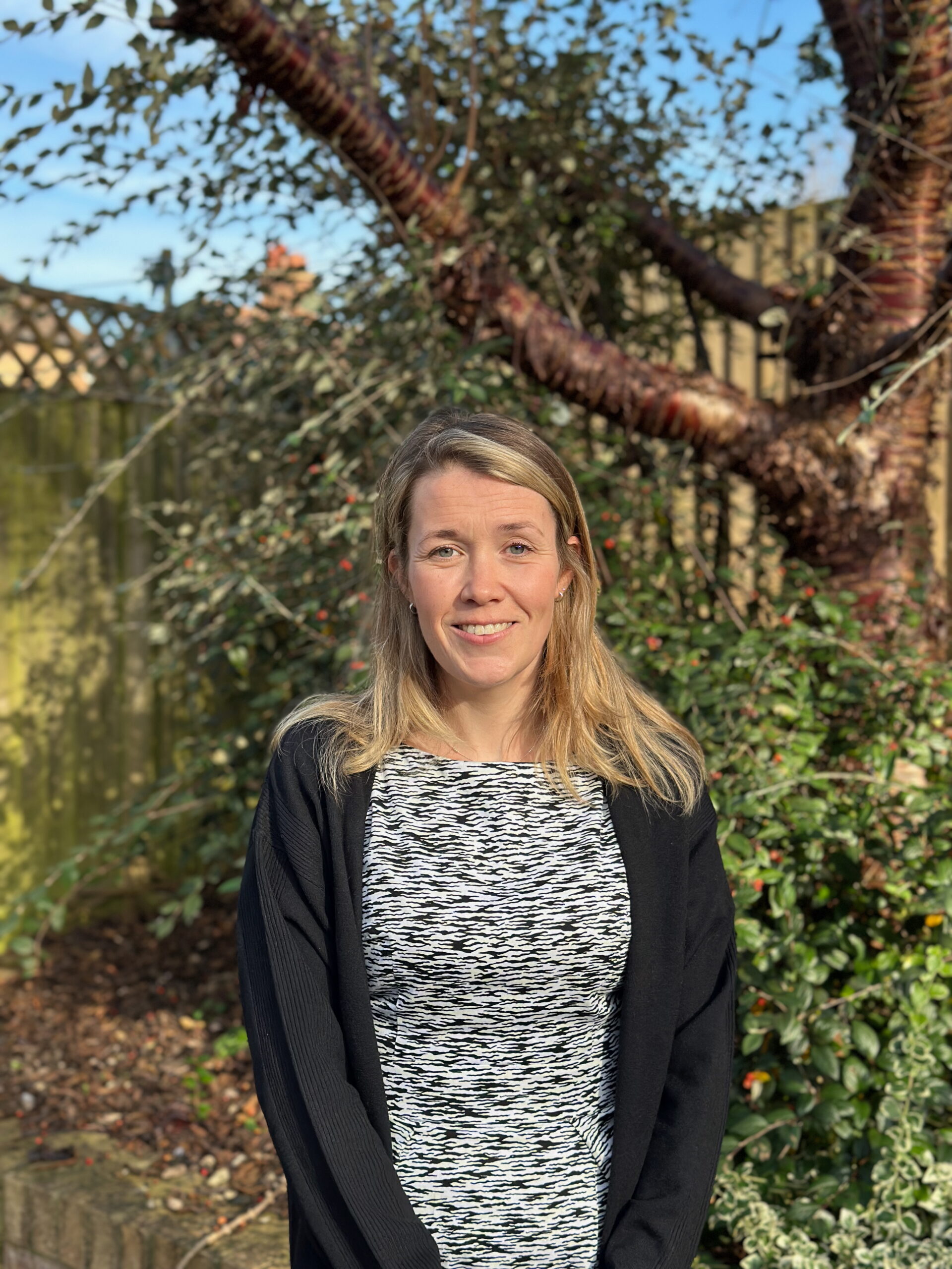 Joanna standing in front of a tree