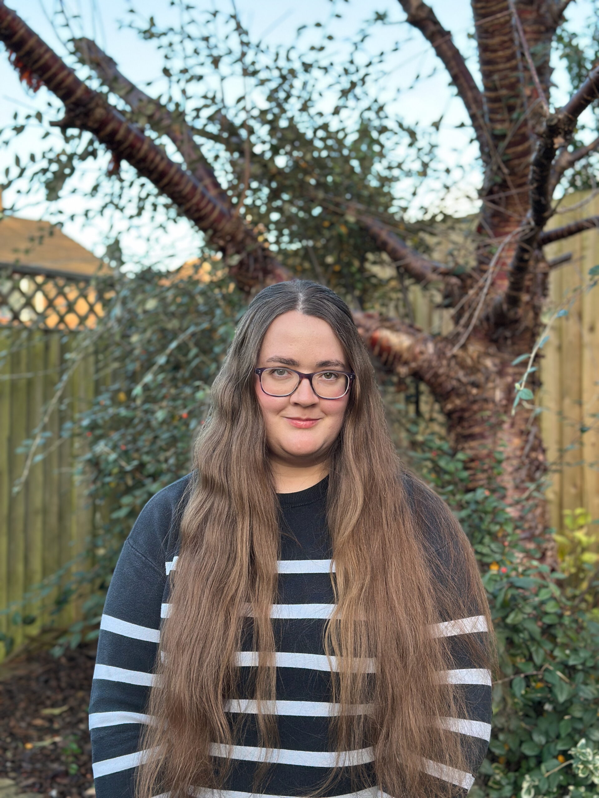 Margaret standing in front of a tree