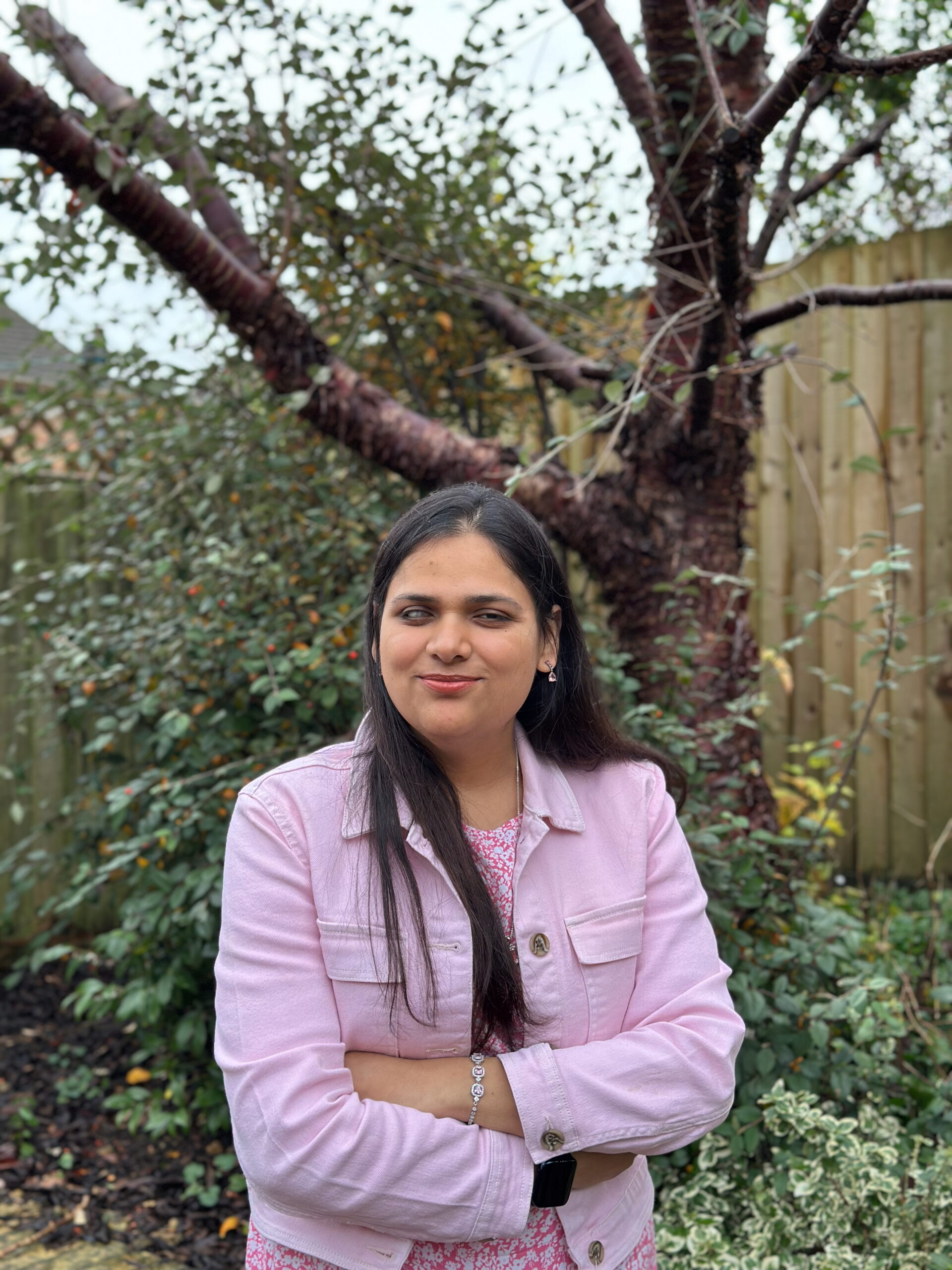 Sammy standing in front of a tree