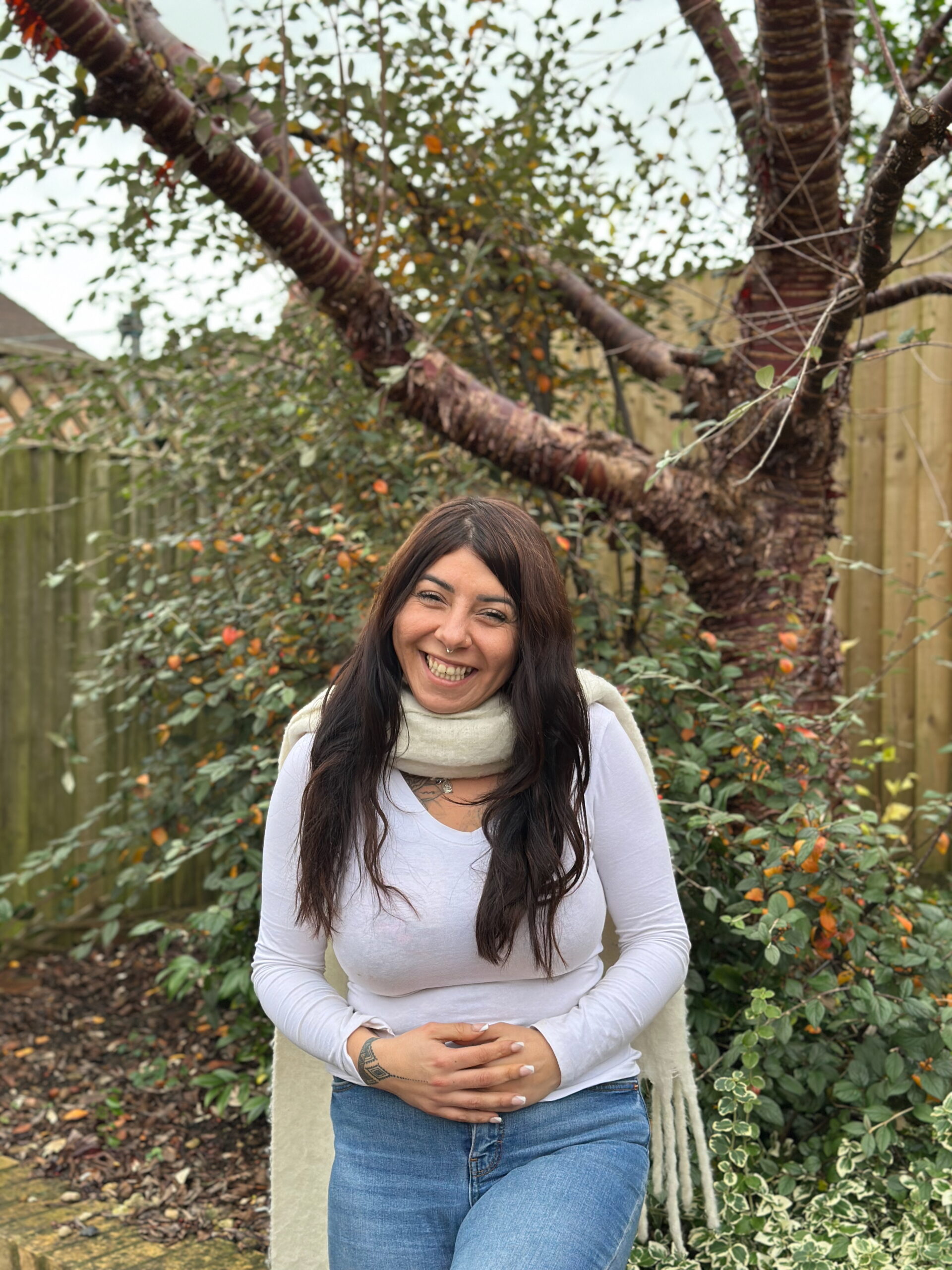 Kiera standing in front of a tree