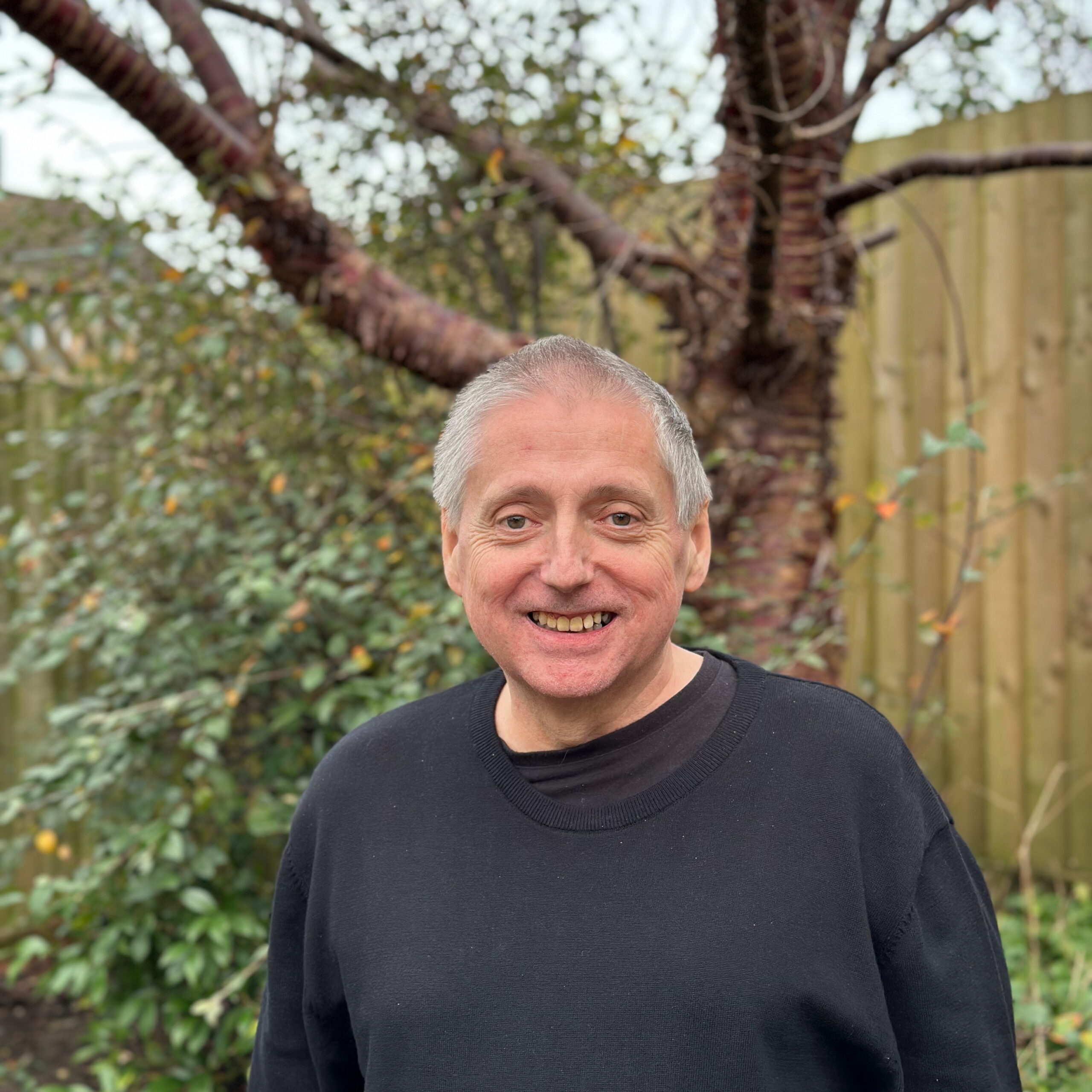 Martin standing in front of a tree