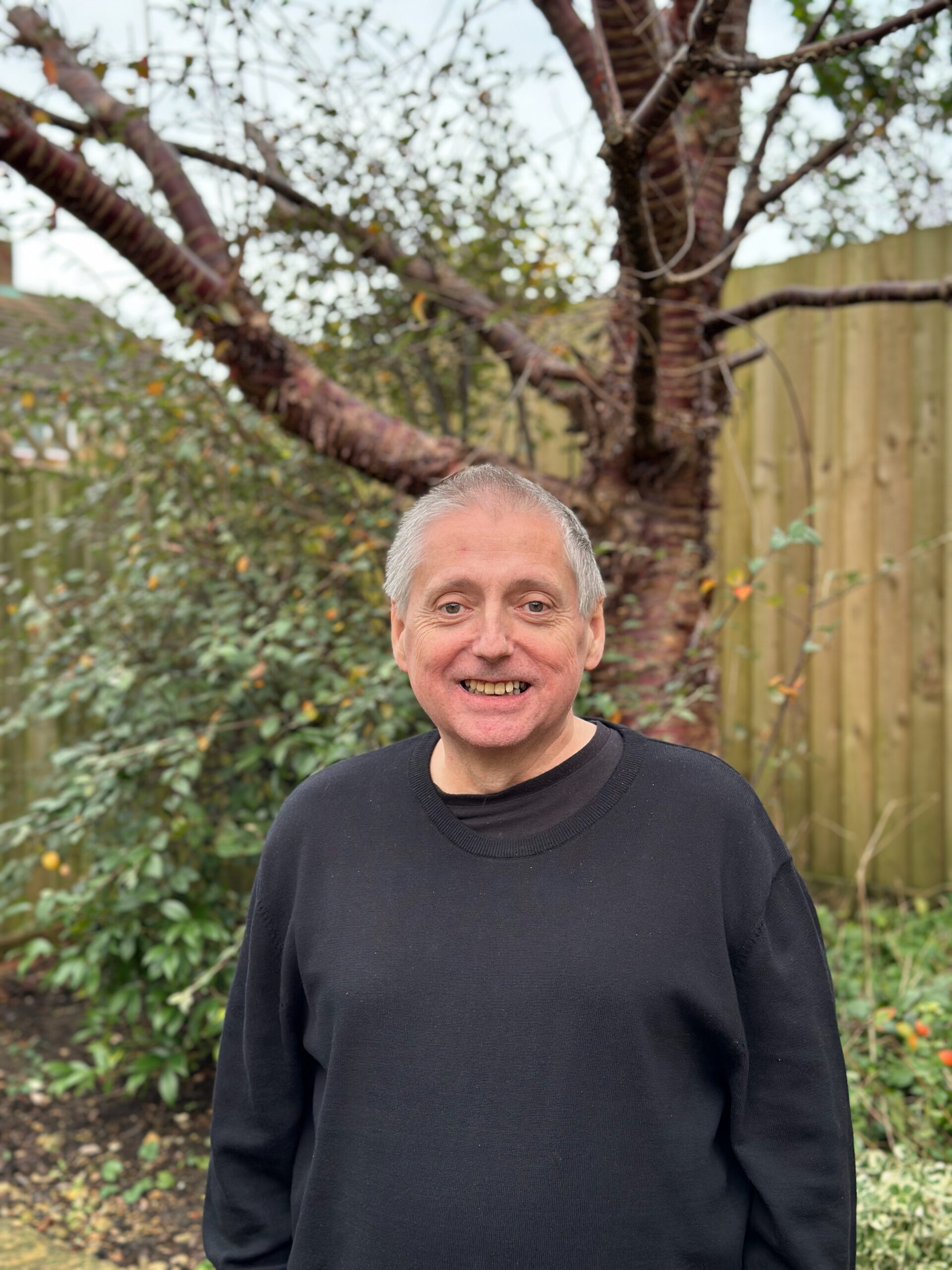 Martin standing in front of a tree