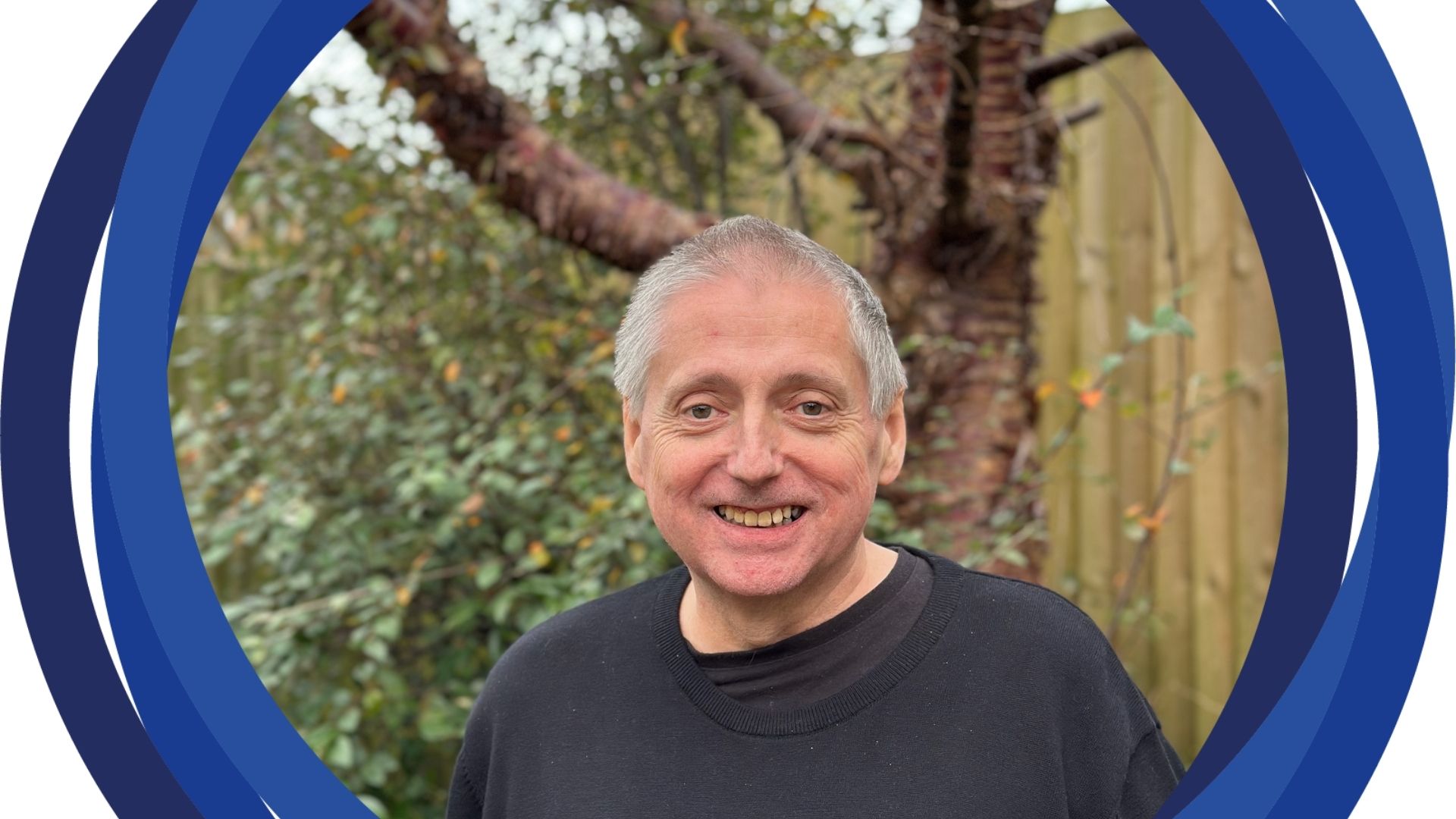 Martin standing in front of a tree